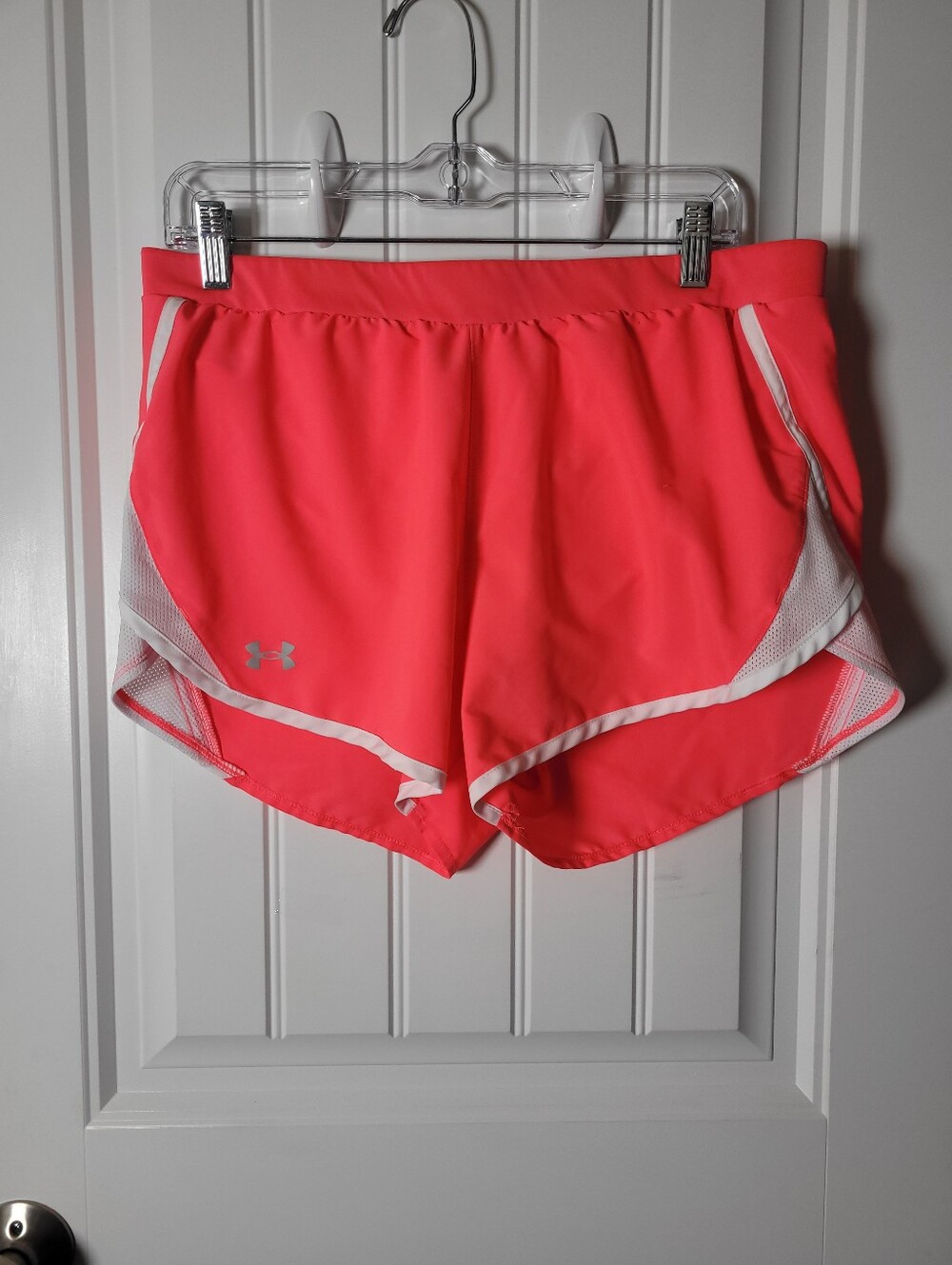 Under Armour Women’s Coral Pink Athletic Shorts with White Trim.  Size Lg